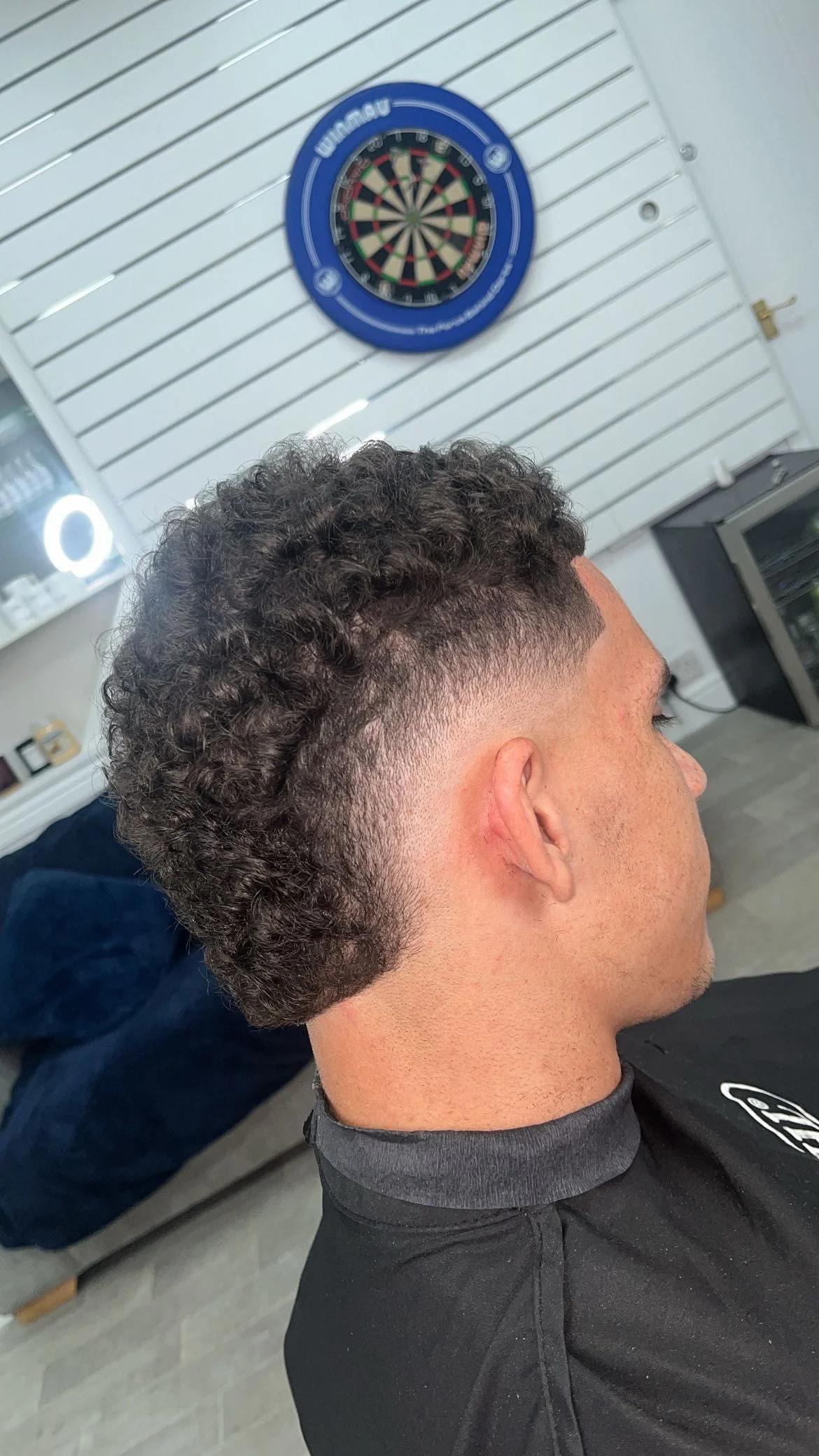 Curly fade with volume